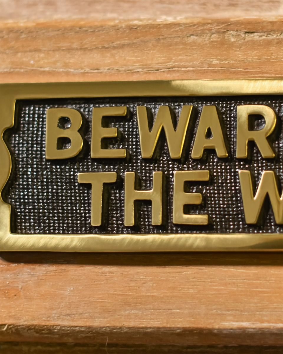 Close up Of Be Aware of the wife - Gate sign