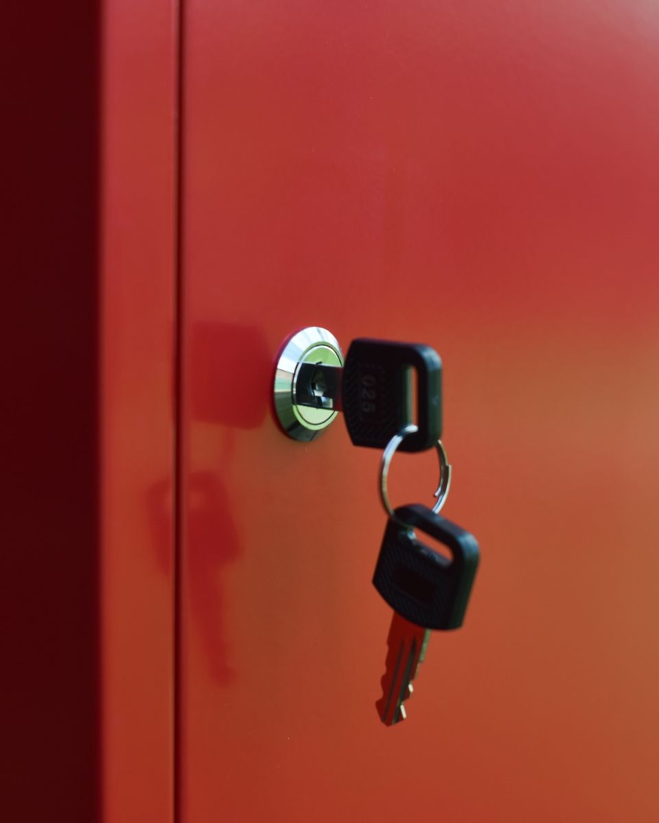 Red Bexley Wall Mounted Parcel Box Close up of key