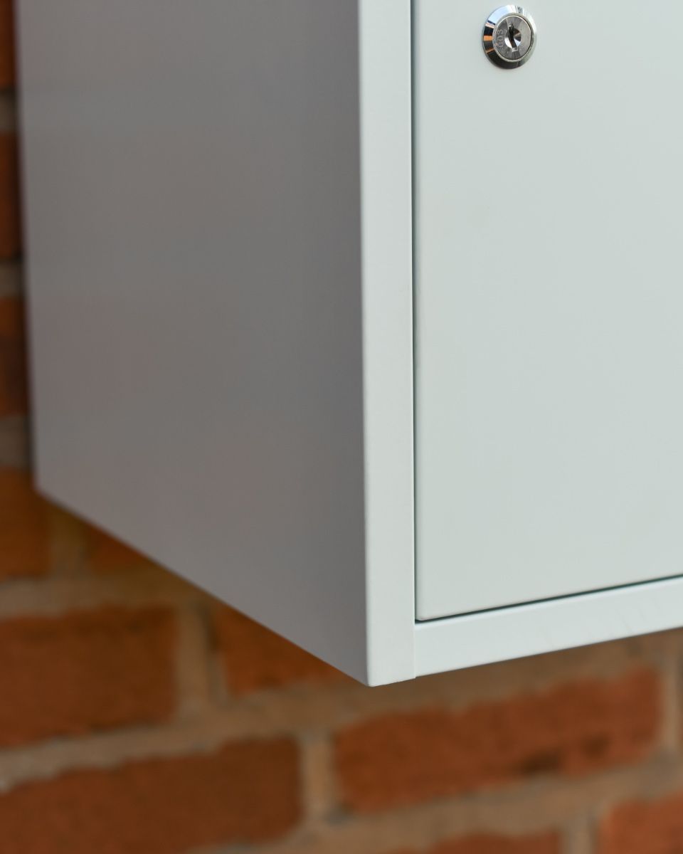 White Bexley Wall Mounted Parcel Box Close up of door and key
