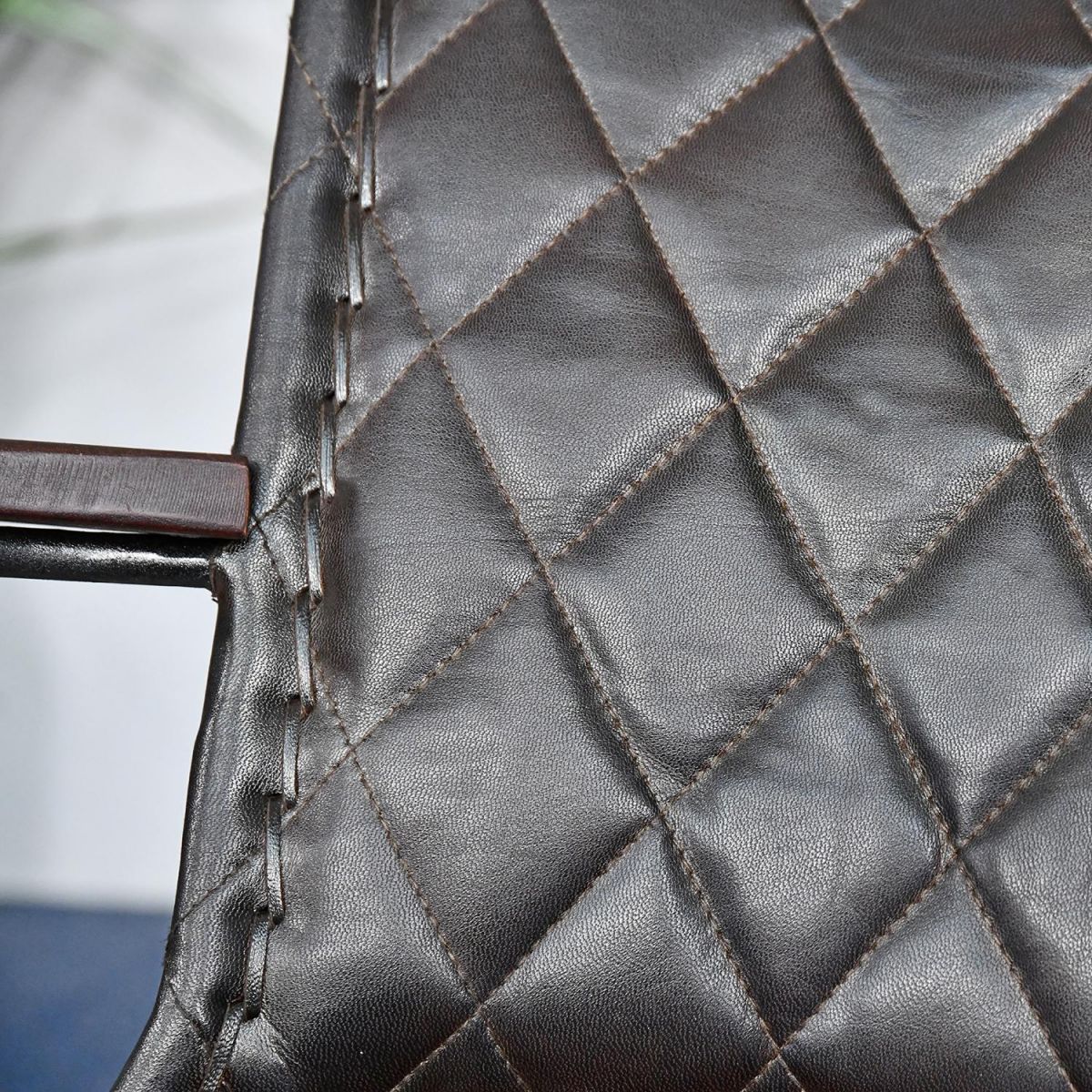 Close up of leather chair with visible stitching 
