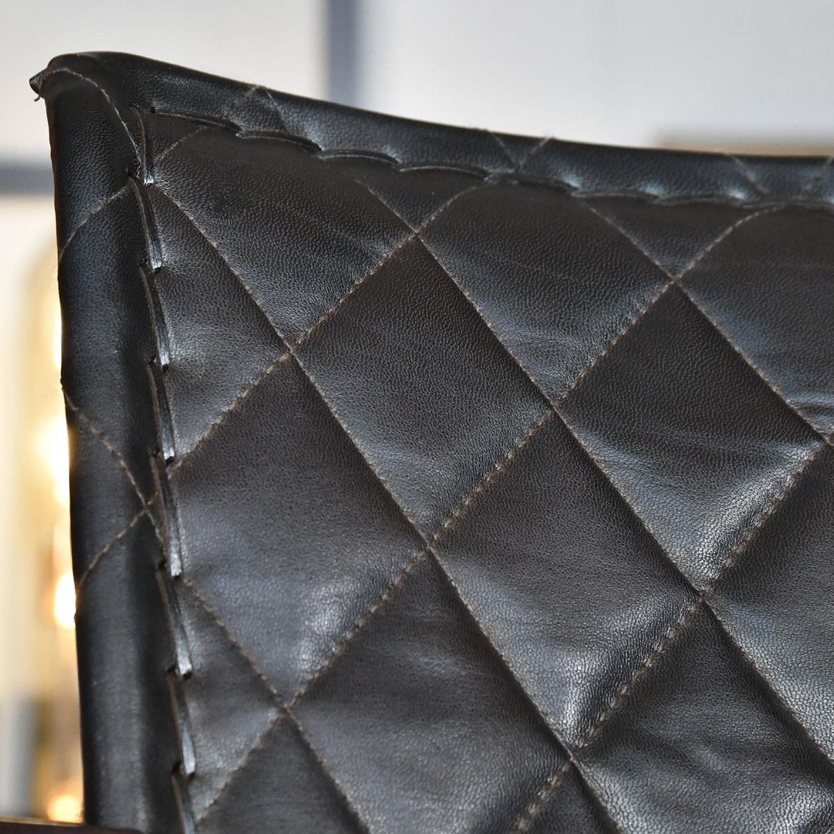 Close up of chair backrest with diamond stitching 