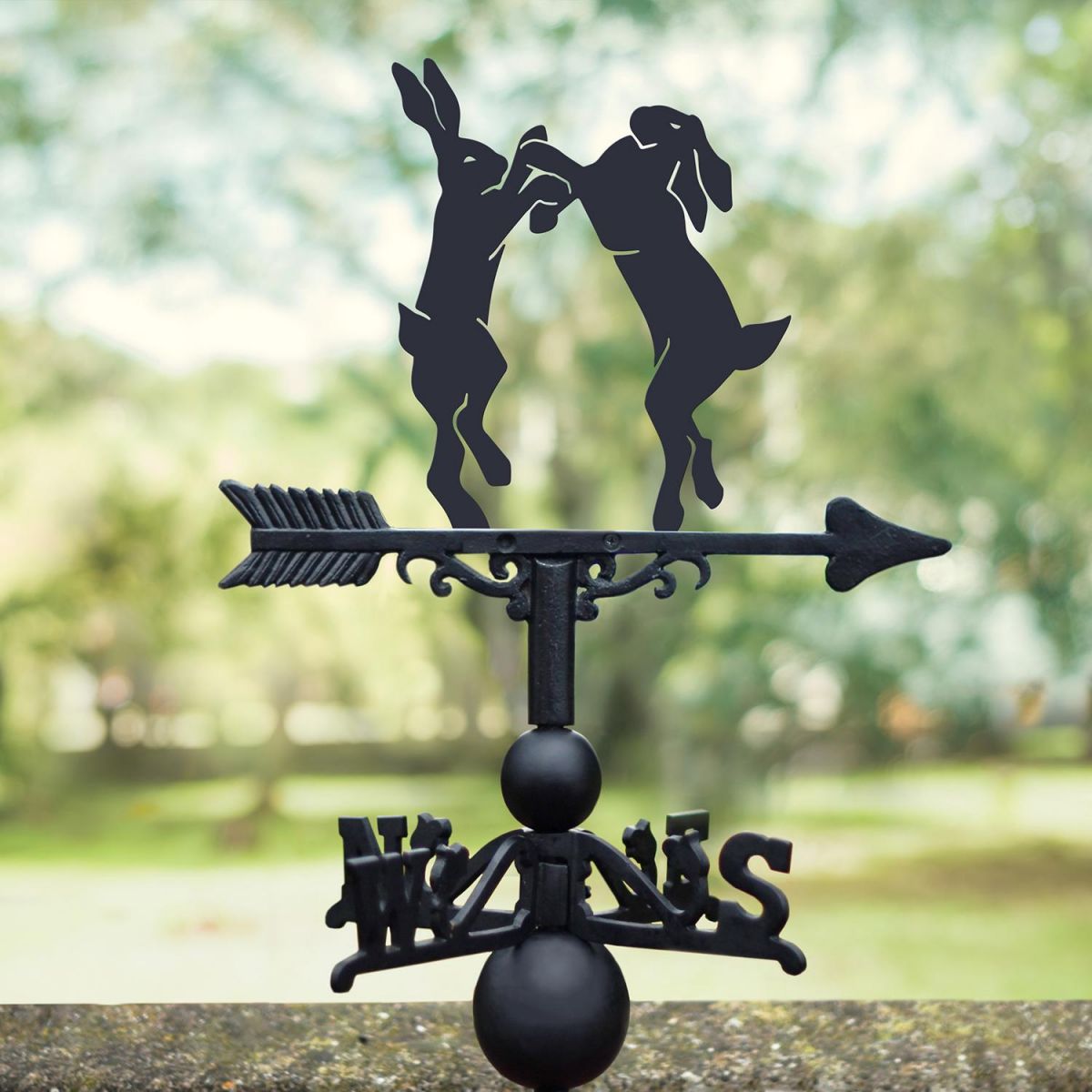 Boxing Hares Weathervane in Situ on a House  Boxing Hares Weathervane in Situ on a House