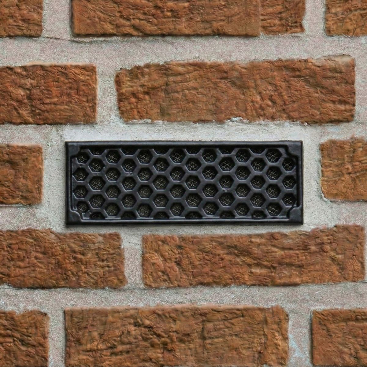 Black "Honeycomb" Cast Iron Air Brick in the Home installed