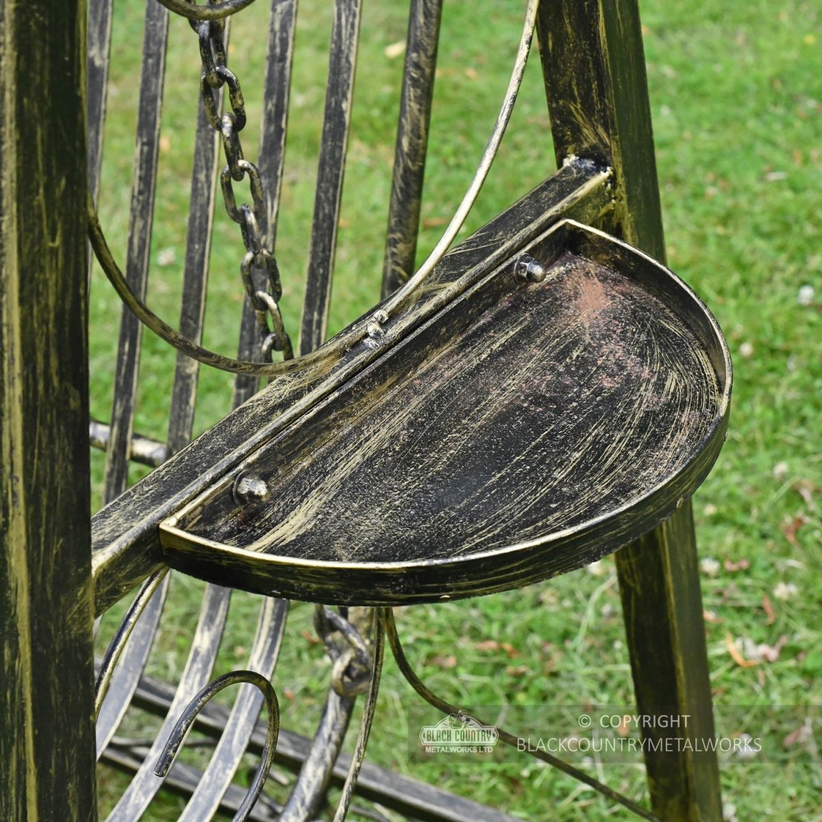 Black and gold side table on garden Swing Seat