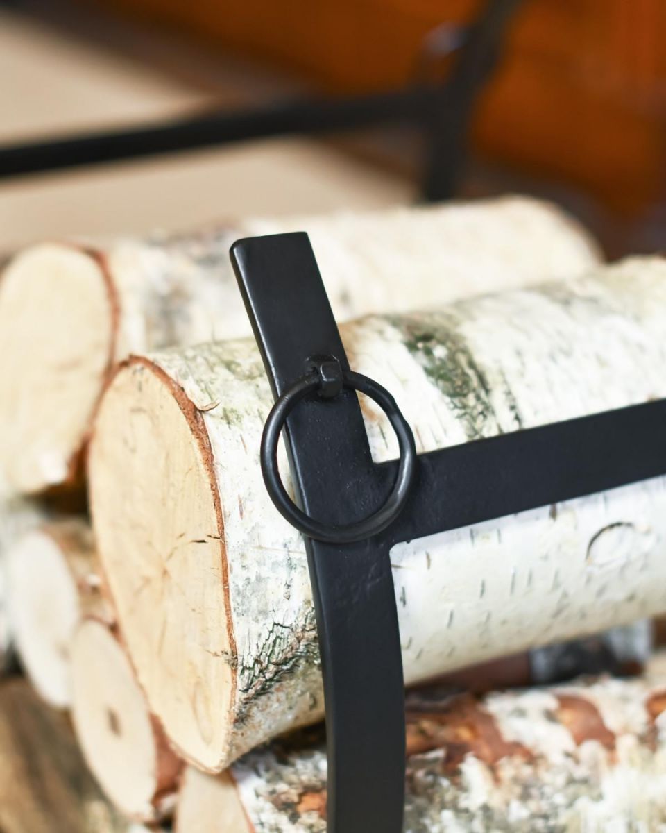 Close Up Of Black Blacksmith Curved Log Rack Close Up Of Black Blacksmith Curved Log Rack