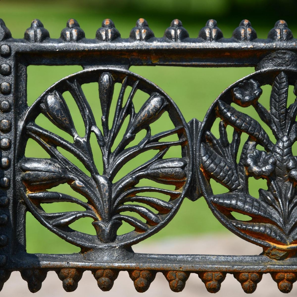 Close up of Aged Black Cast Iron Circular motifs