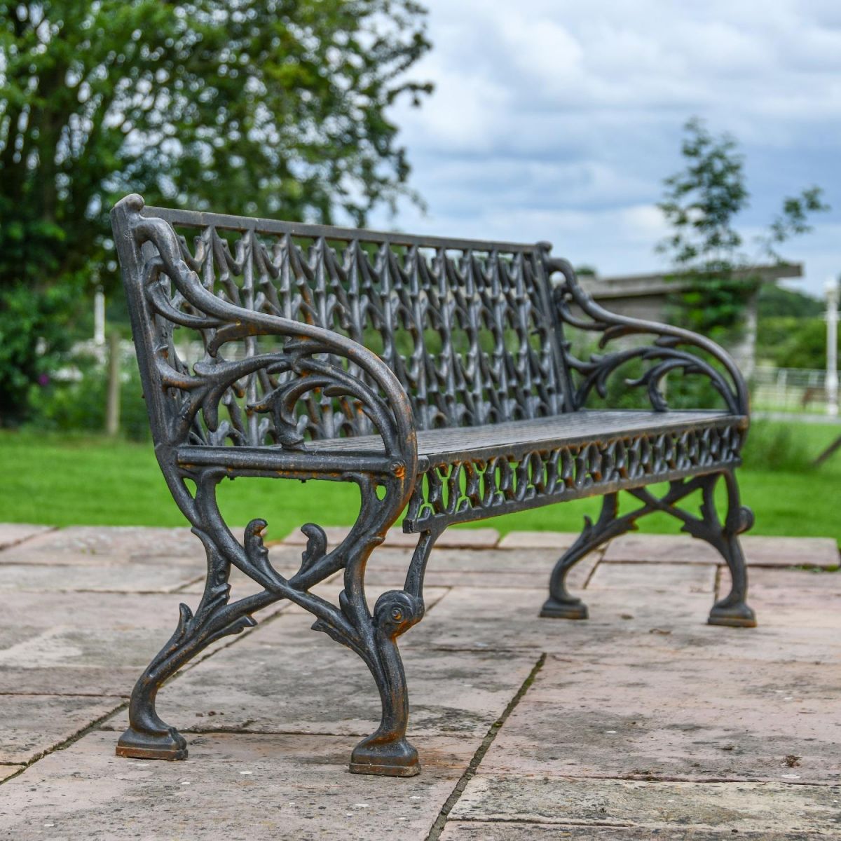 Side view of Cast Iron Aged Black Victorian Three Seater Bench  Side view of Cast Iron Aged Black Victorian Three Seater Bench