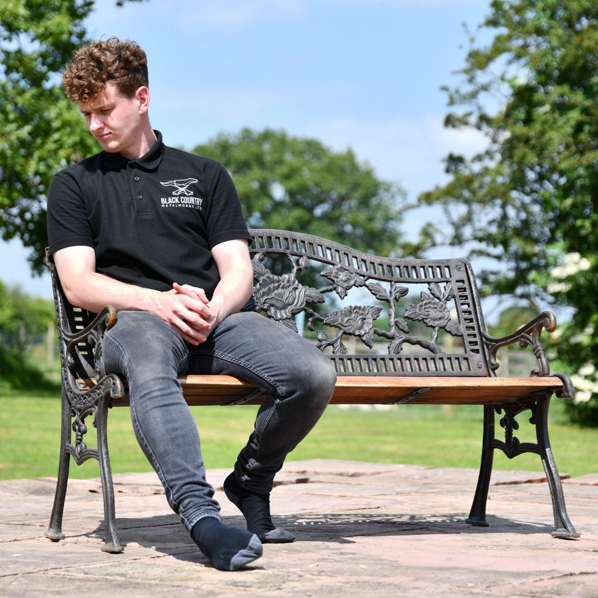 Cast Iron Aged Black & Wood Garden Bench with Male for Scale