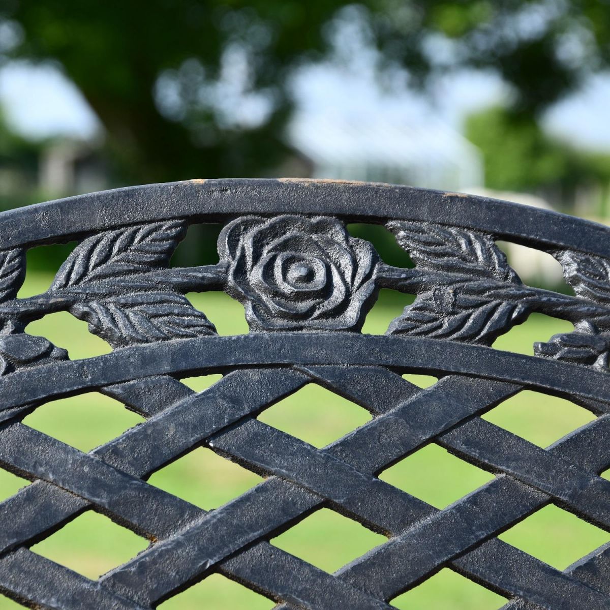 Close up of Cast Iron Aged Black Rose Motif with Lattice Design on Backrest