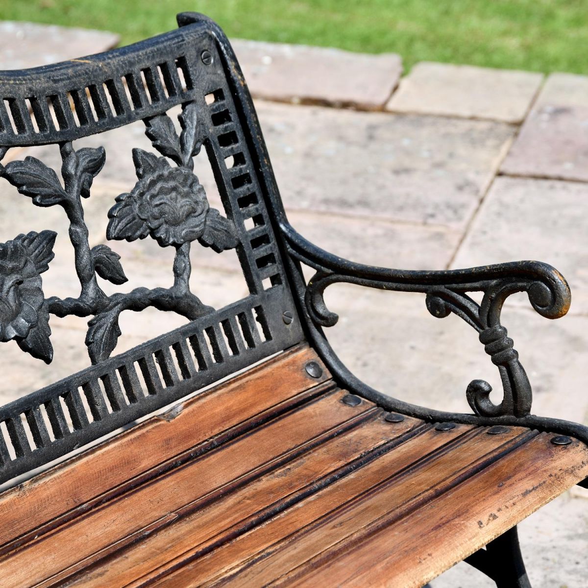 Close up of Aged Black Cast Iron Frame & Wood Slats