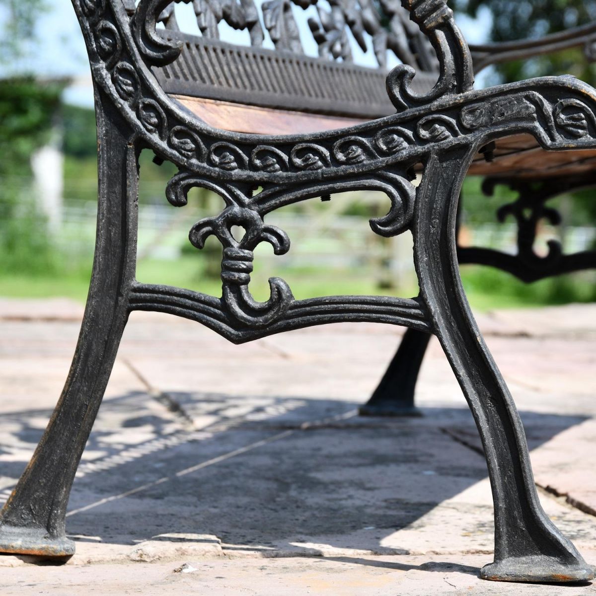 Close up of Aged Black Cast Iron Frame and Bench Legs