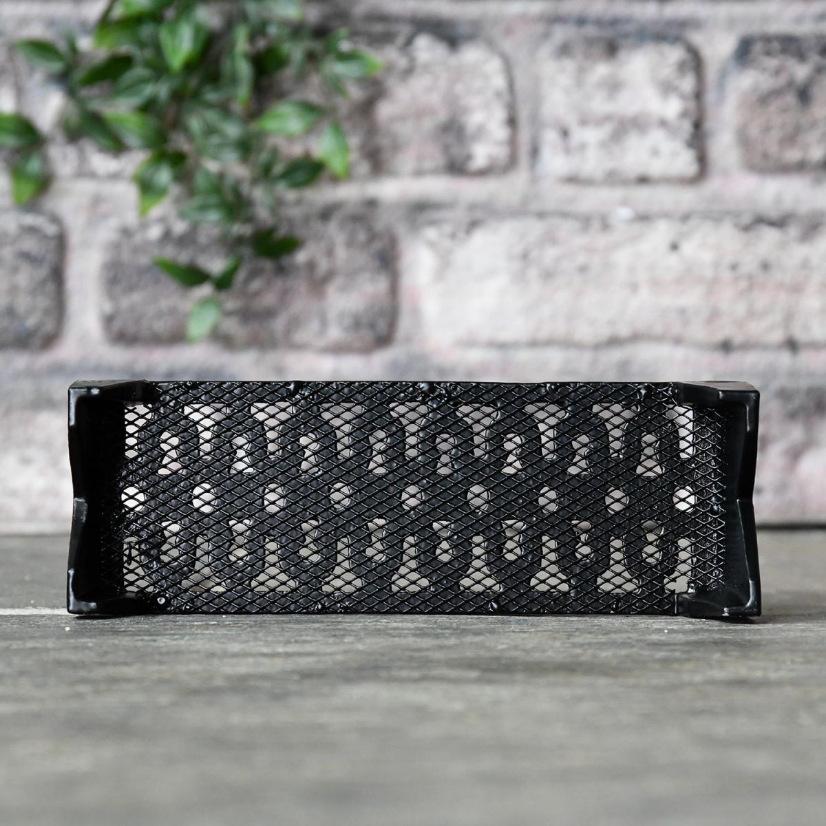 View of the Mesh on the Back of the Black Cast Iron "Keyhole Pattern" Air Brick