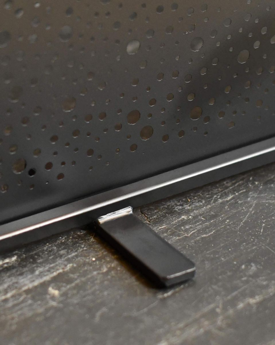 Close-Up of Feet on Black Circular Cut-Out Single Panel Fire Guard