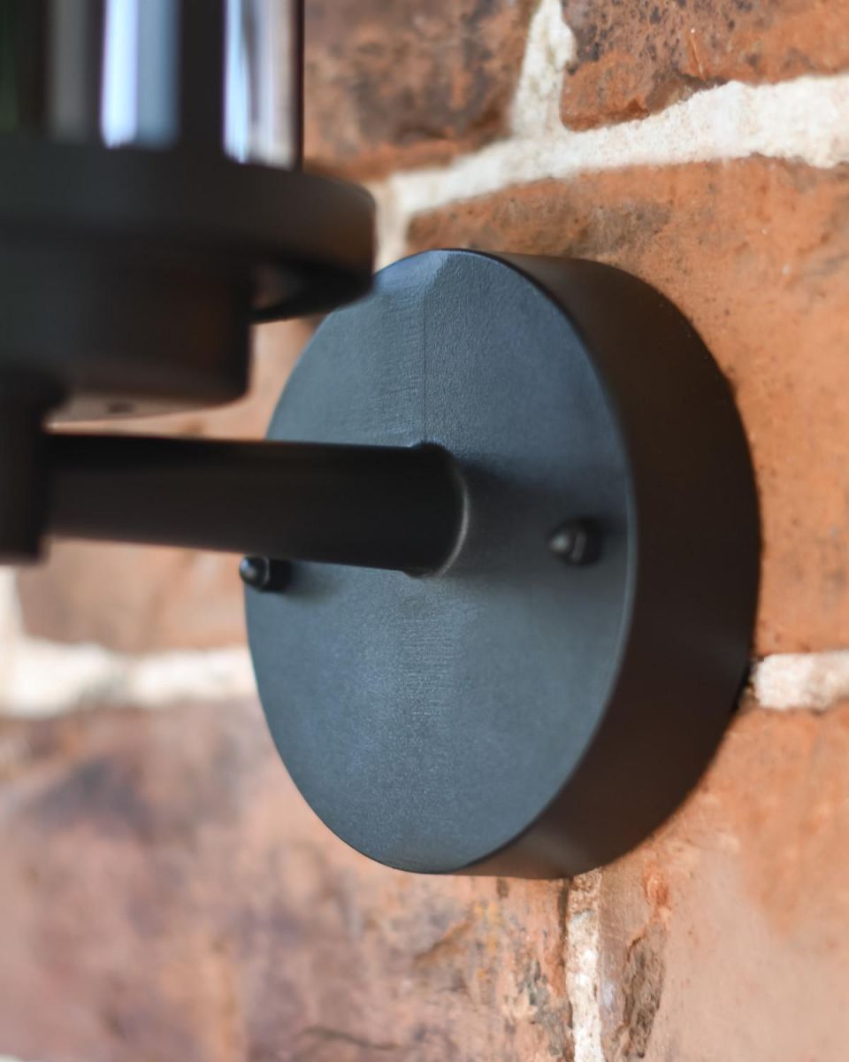 Close-Up of Circular Backplate on Black Contemporary "Charlotte" Outdoor Wall Light Close-Up of Circular Backplate on Black Contemporary "Charlotte" Outdoor Wall Light