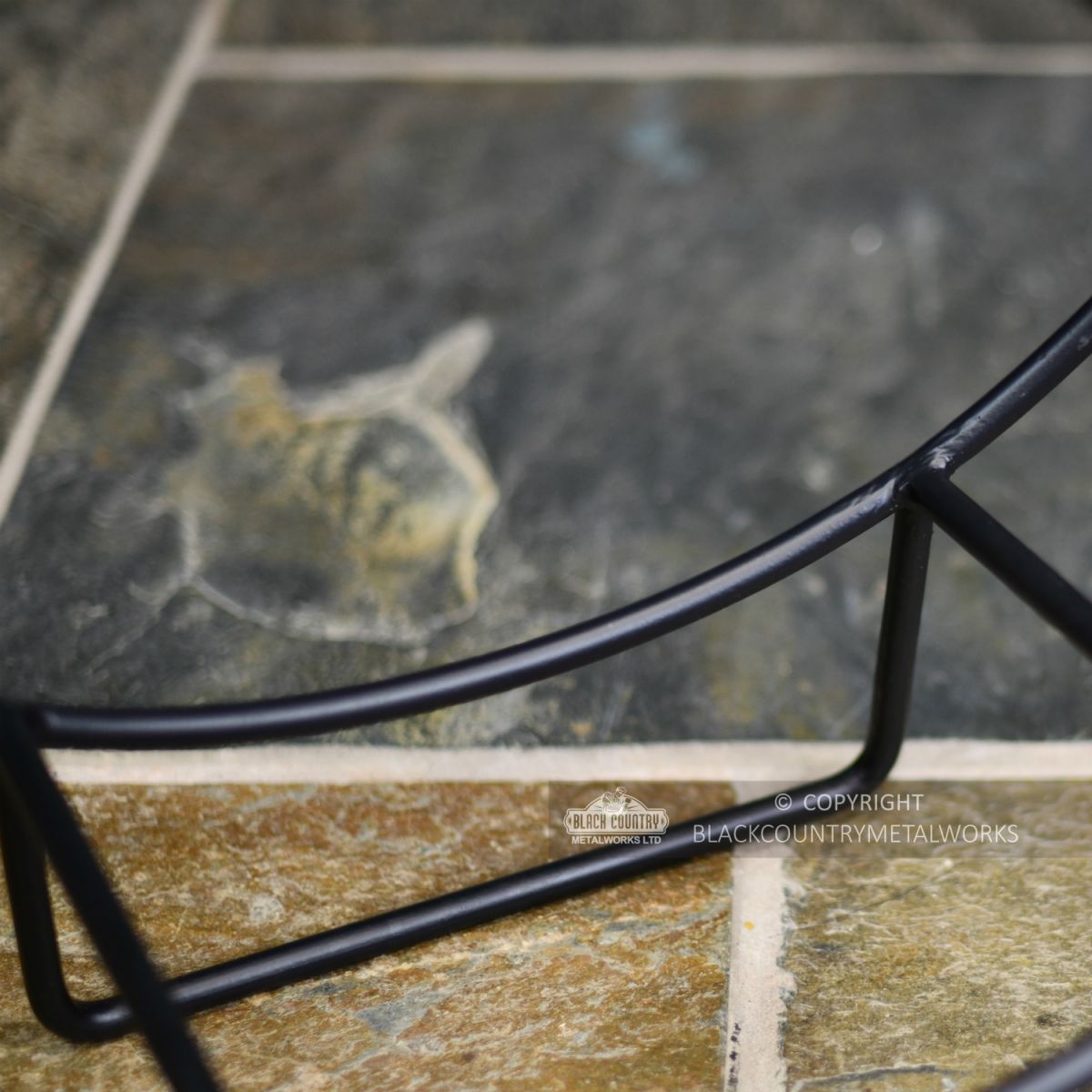 Black Contemporary Circular Log Basket With Brown Handle Close Up Black Contemporary Circular Log Basket With Brown Handle Close Up