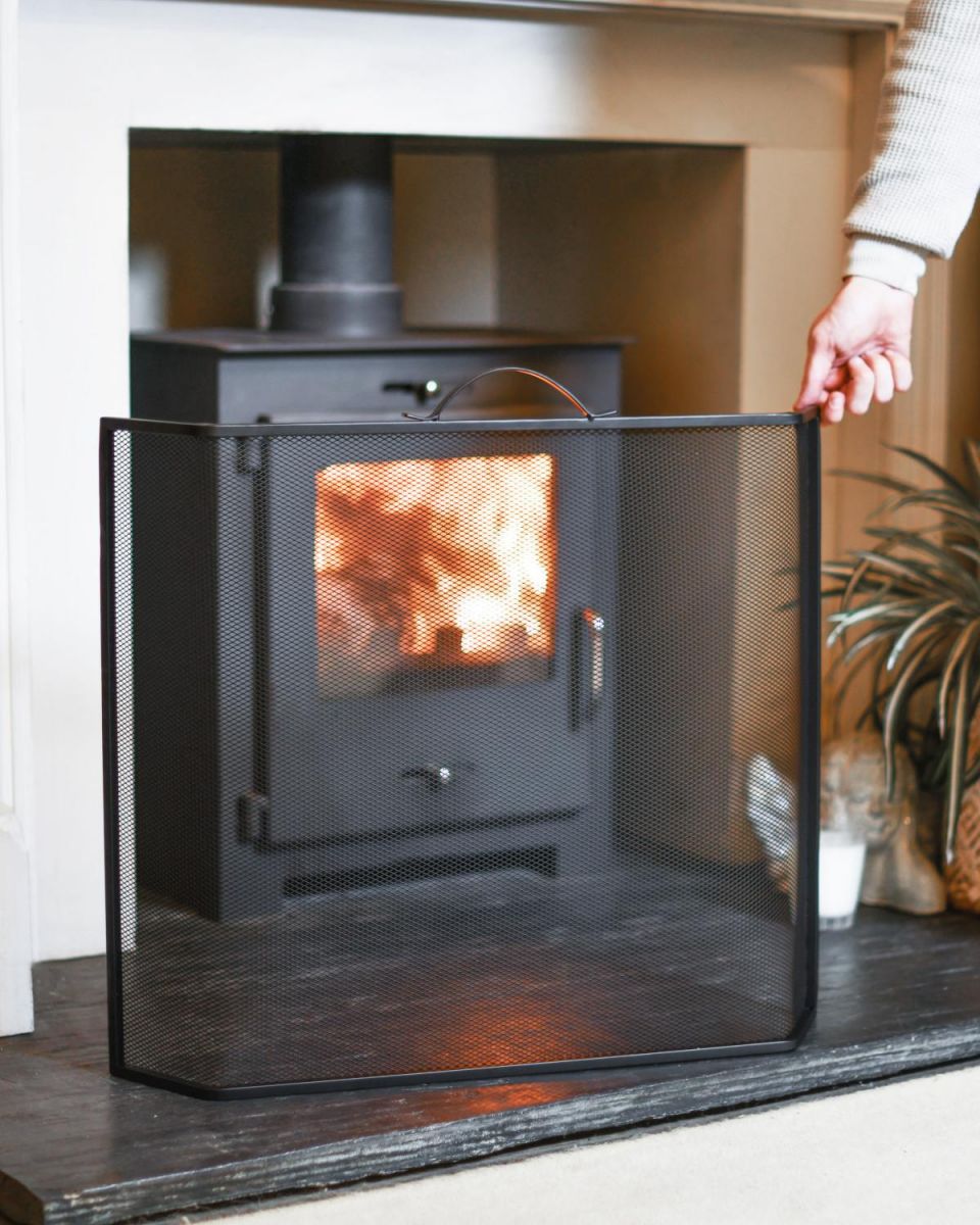 Scale Shot Of Black Contemporary Curved Fire Guard with Handle Scale Shot Of Black Contemporary Curved Fire Guard with Handle