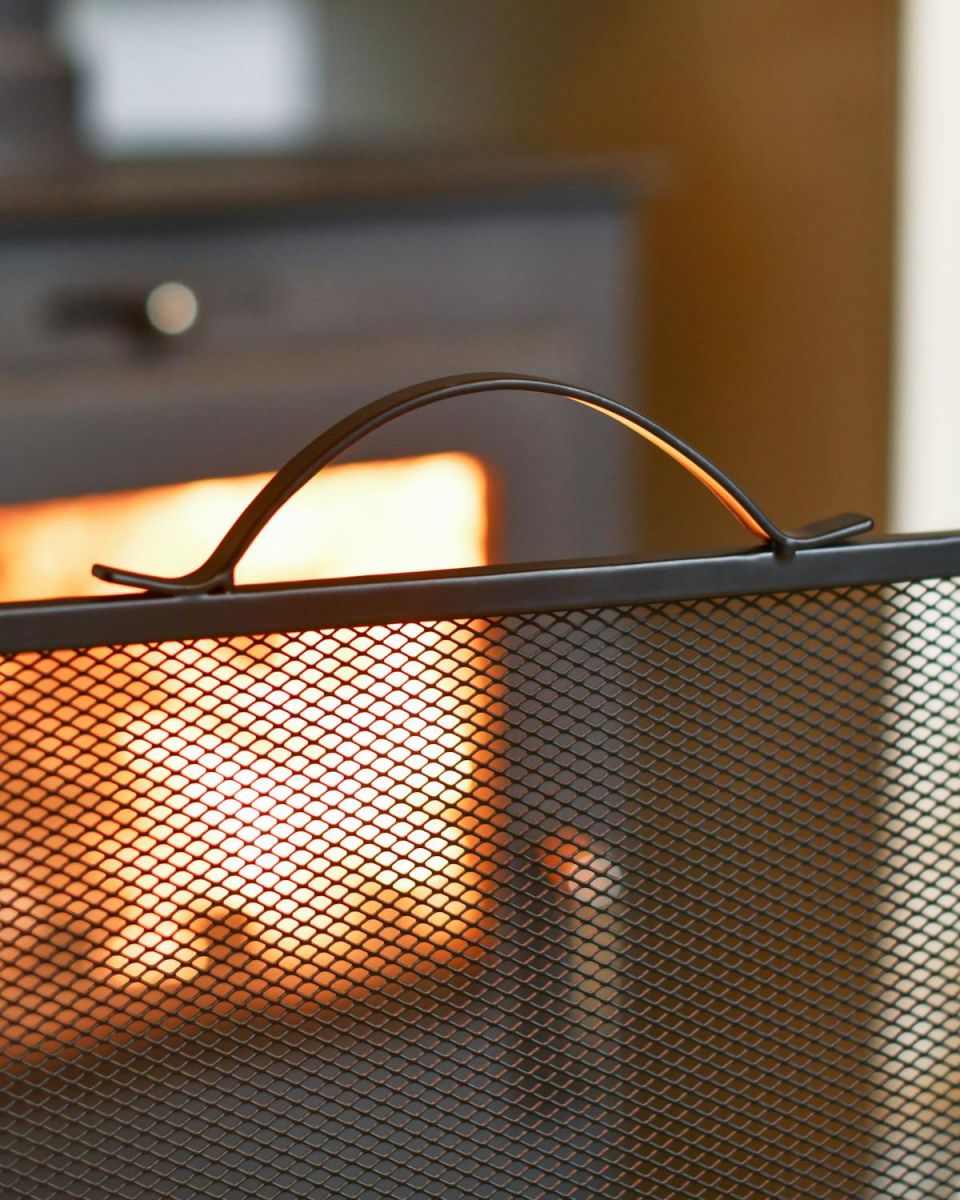 Close Up Of Black Contemporary Curved Fire Guard with Handle Close Up Of Black Contemporary Curved Fire Guard with Handle