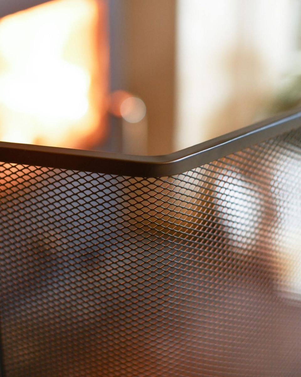 Close Up Of Black Contemporary Curved Fire Guard with Handle Mesh Close Up Of Black Contemporary Curved Fire Guard with Handle Mesh