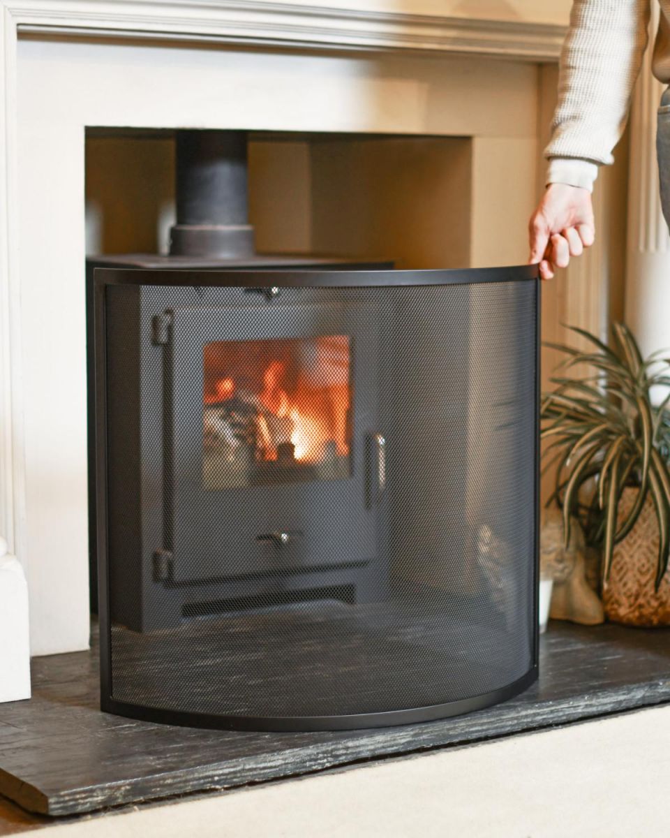 Scale Shot Of Black Contemporary Curved Single Panel Fire Guard