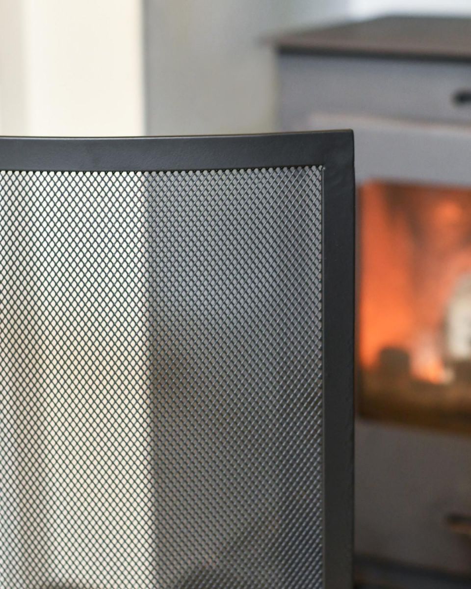Black Close Up Of Contemporary Curved Single Panel Fire Guard In Situ