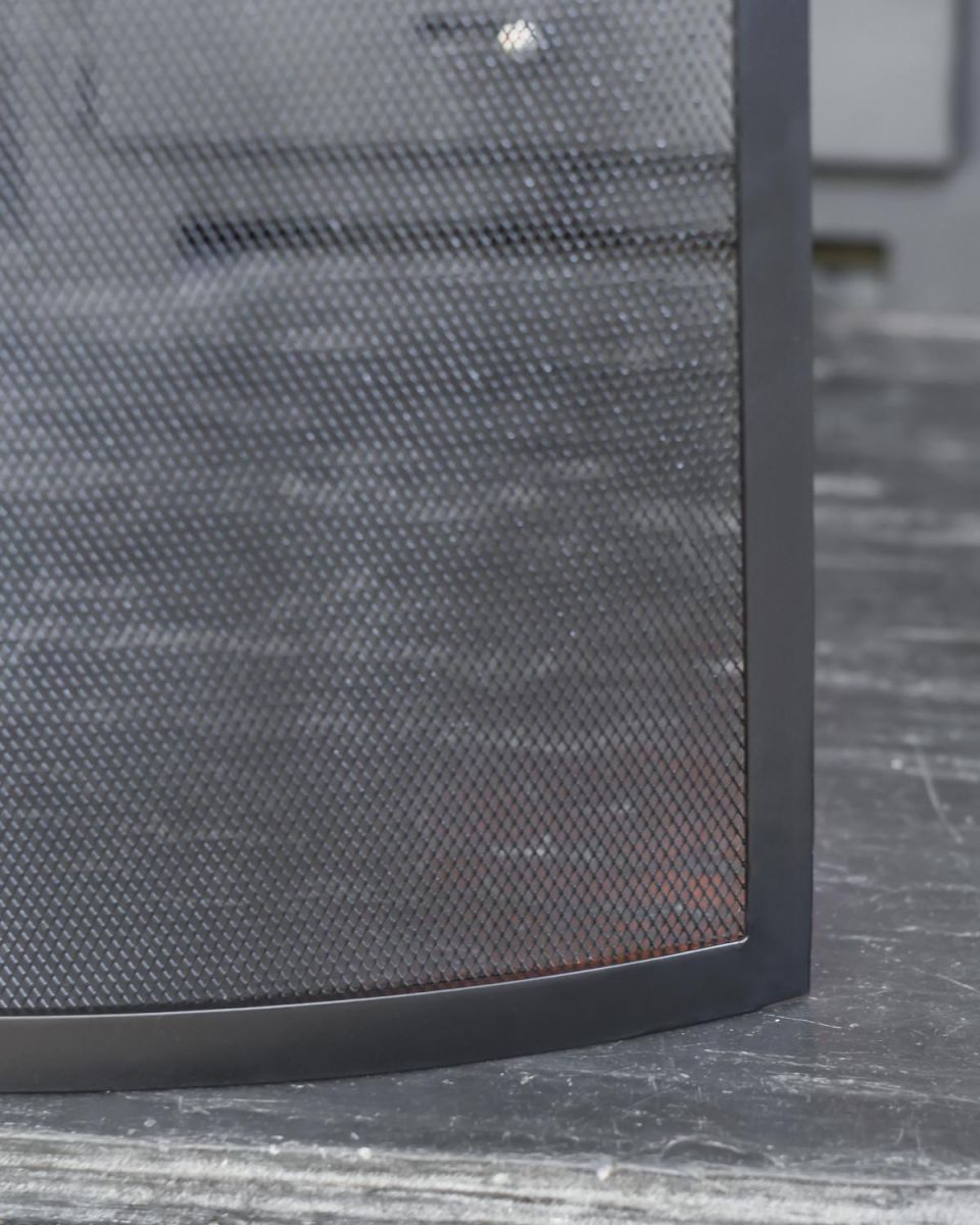 Close Up Of Black Contemporary Curved Single Panel Fire Guard Bottom Edge