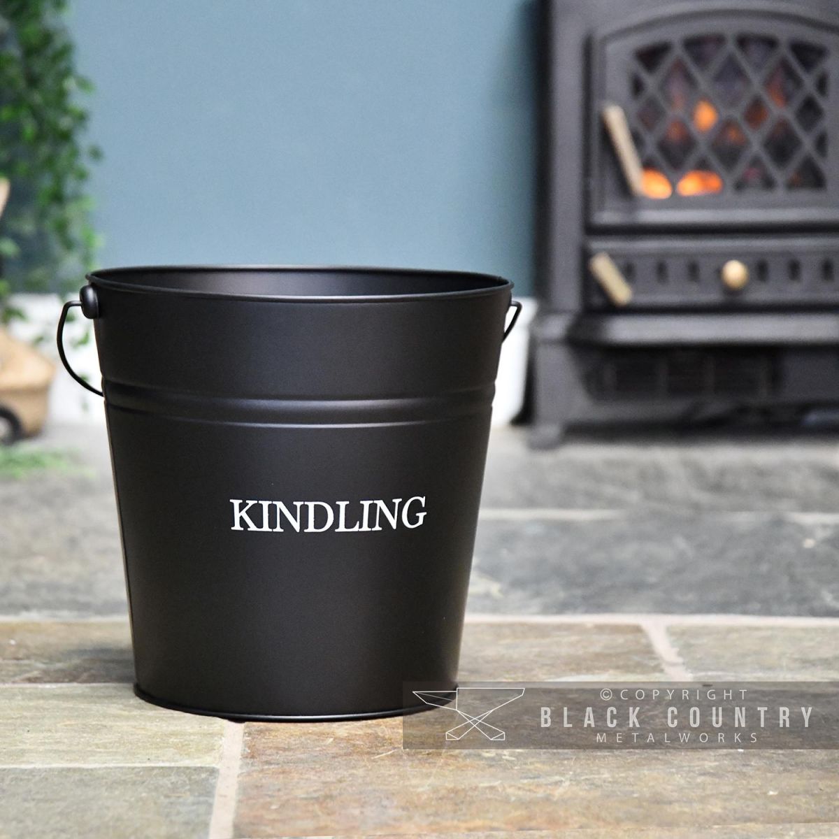 Black Contemporary Kindling Bucket in Situ by the Fire Place
