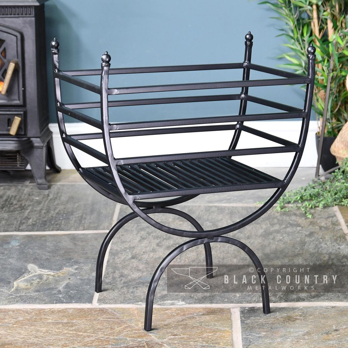 Curved Log Holder Created From Iron and Finished in Black Curved Log Holder Created From Iron and Finished in Black