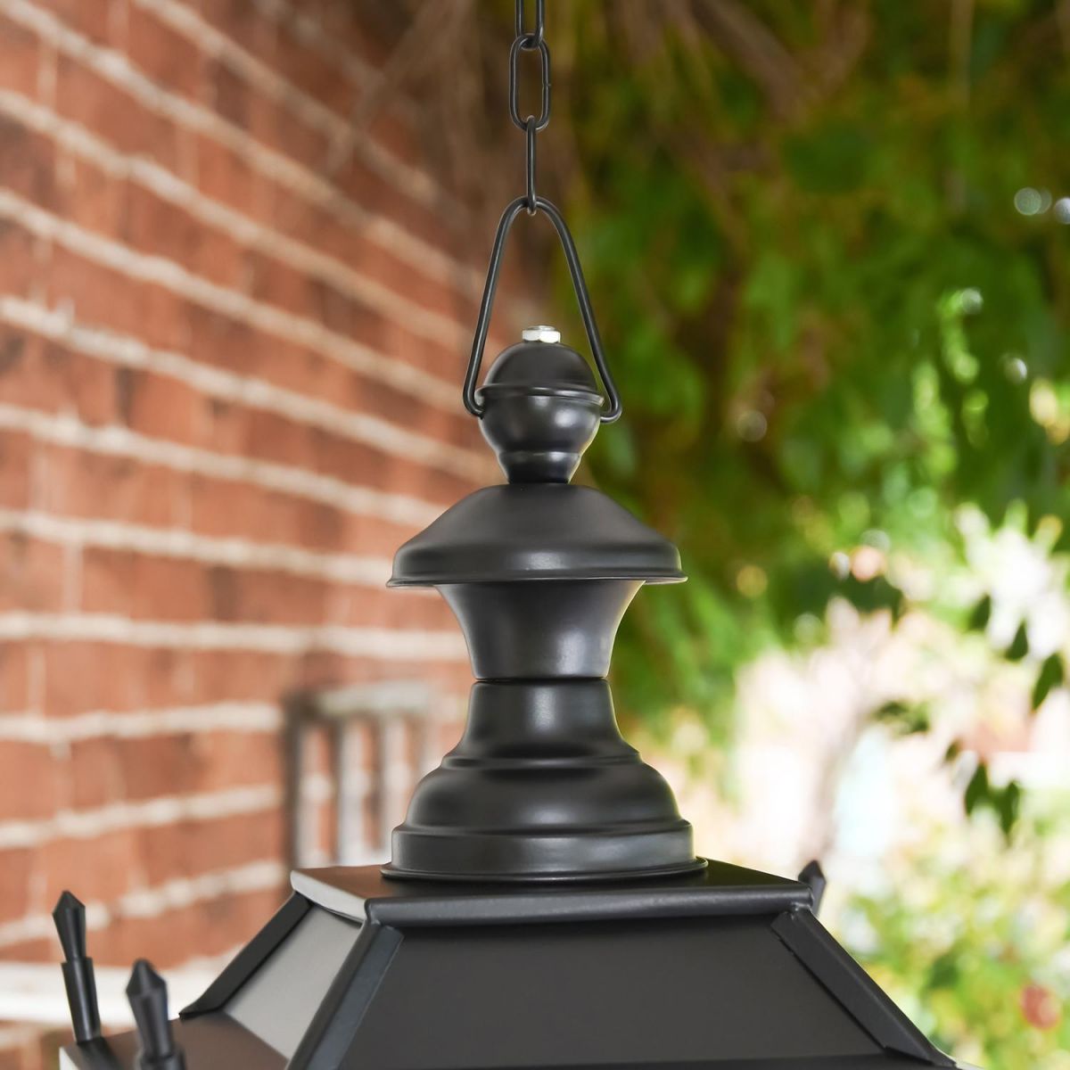 Close-up of the traditioanl Victorian Finial on the Top of the Chain Hanging Lantern