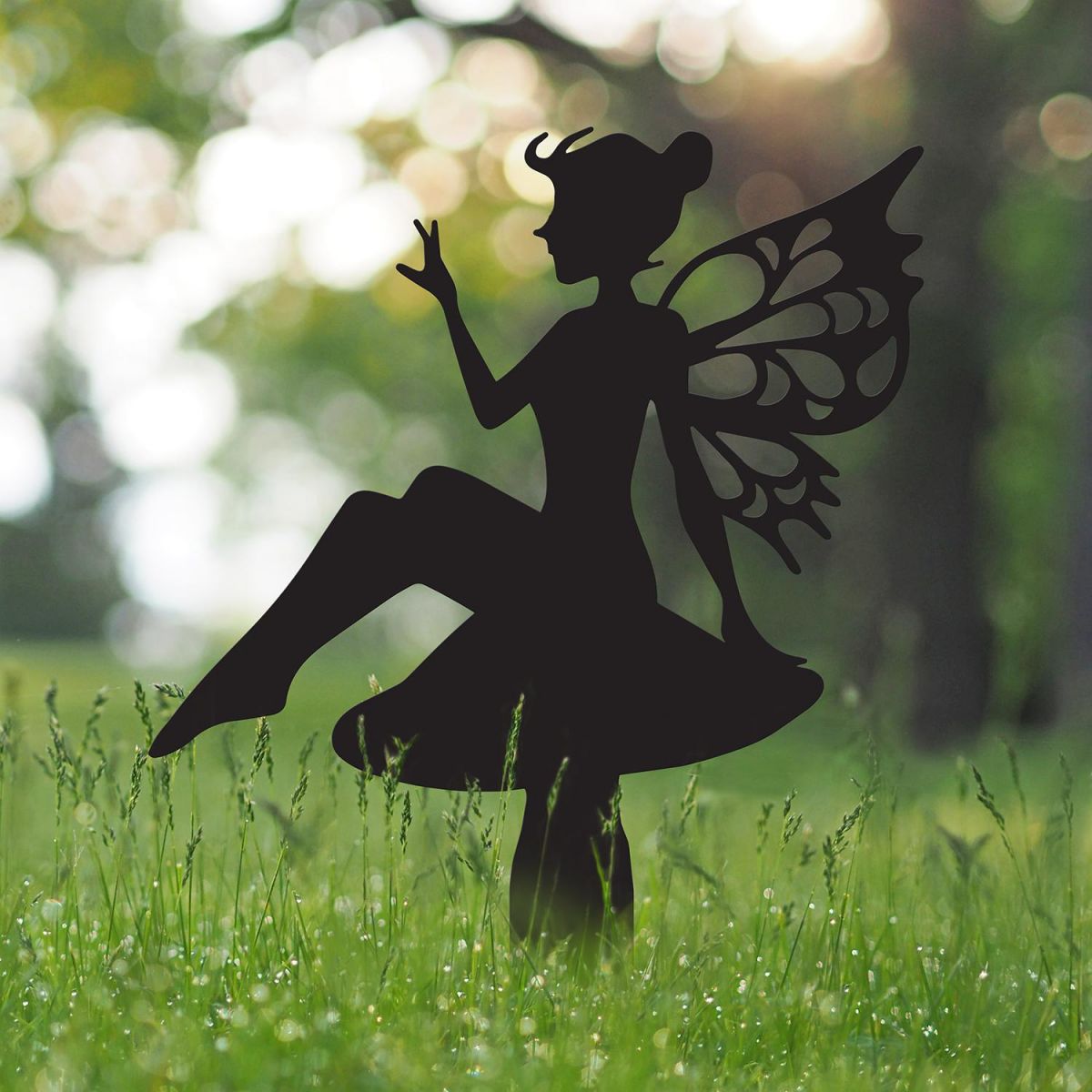 Flower Fairy Sitting on Toad Stool Silhouette in Situ in the Garden