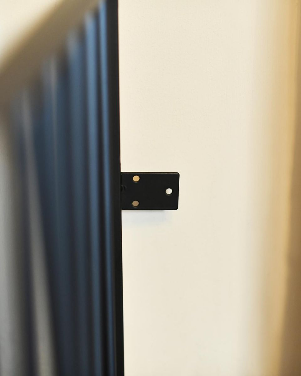 Close-up of the Wall Fixing Plate on the Fir3e Surround