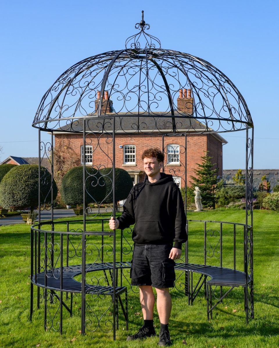 "Kensington" Domed Wrought Iron Gazebo in a Midnight Black Finish with a Man Stood in Shot for Scale