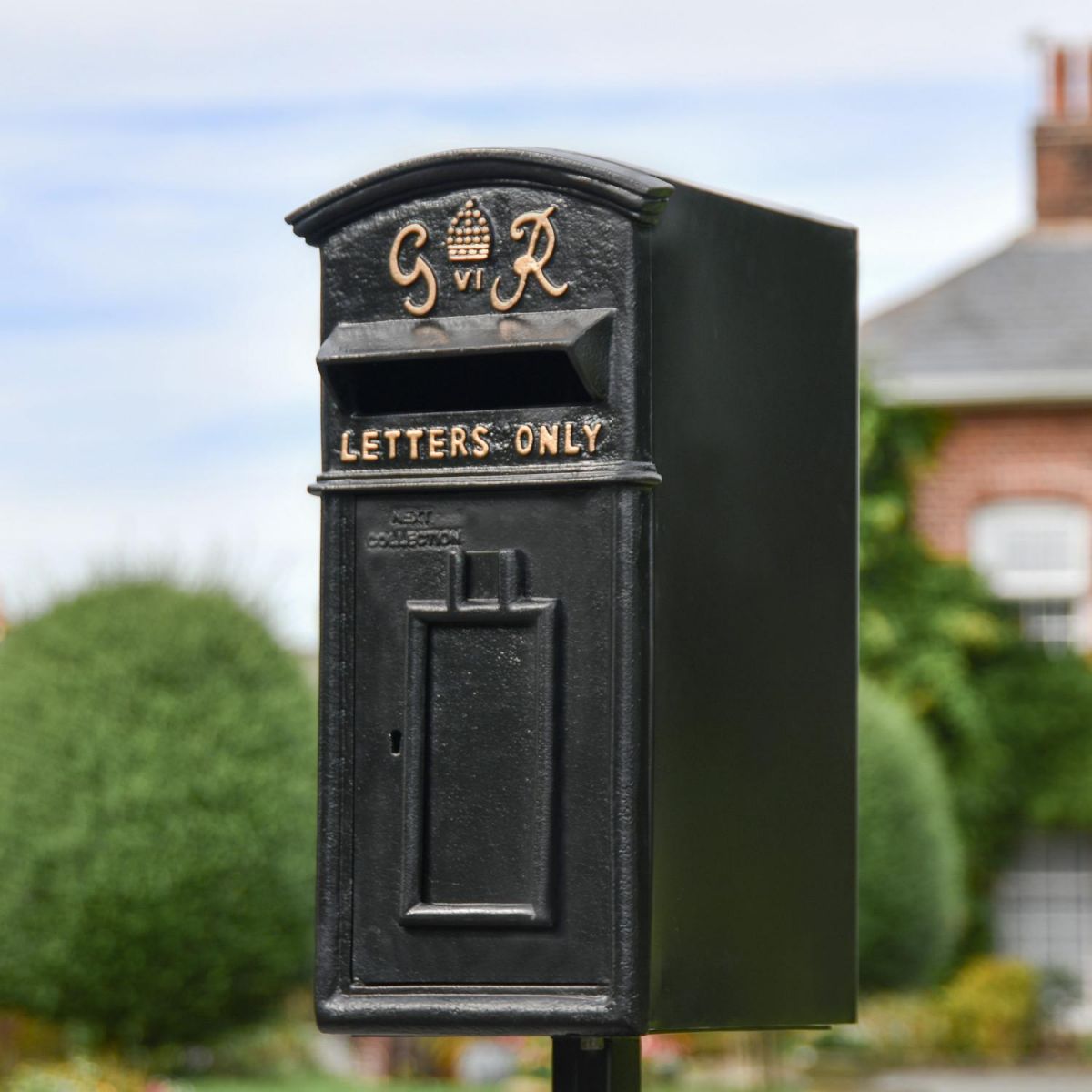 Close-Up of Black & Gold "Goldney" King George Curved Roof Post Box
