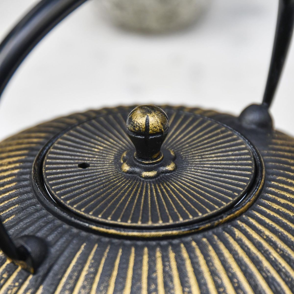 Close-Up of Closed Lid on Cast Iron Teapot Close-Up of Closed Lid on Cast Iron Teapot