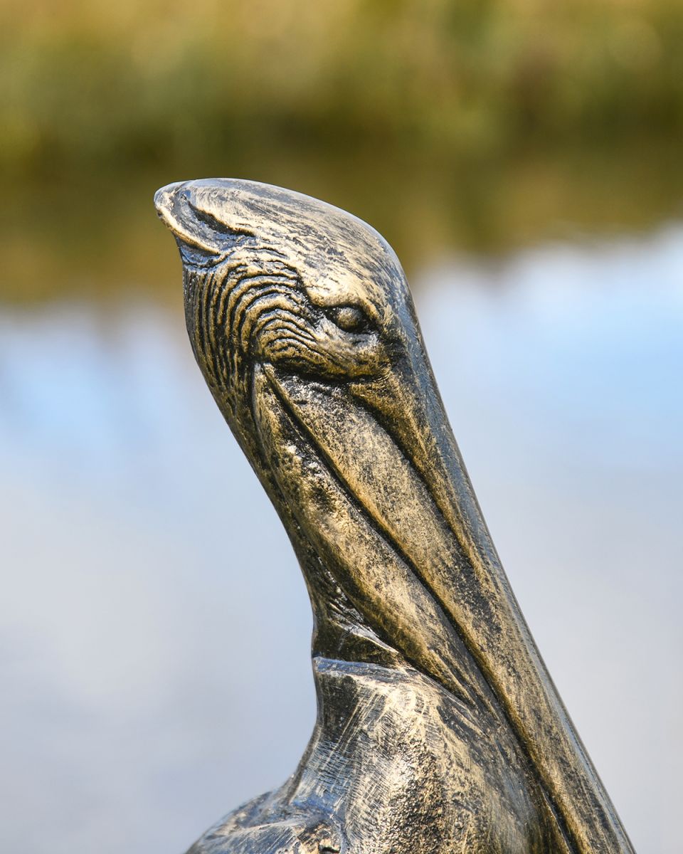 Close-up of the Face of the Brushed Gold Pelican Garden Sculpture