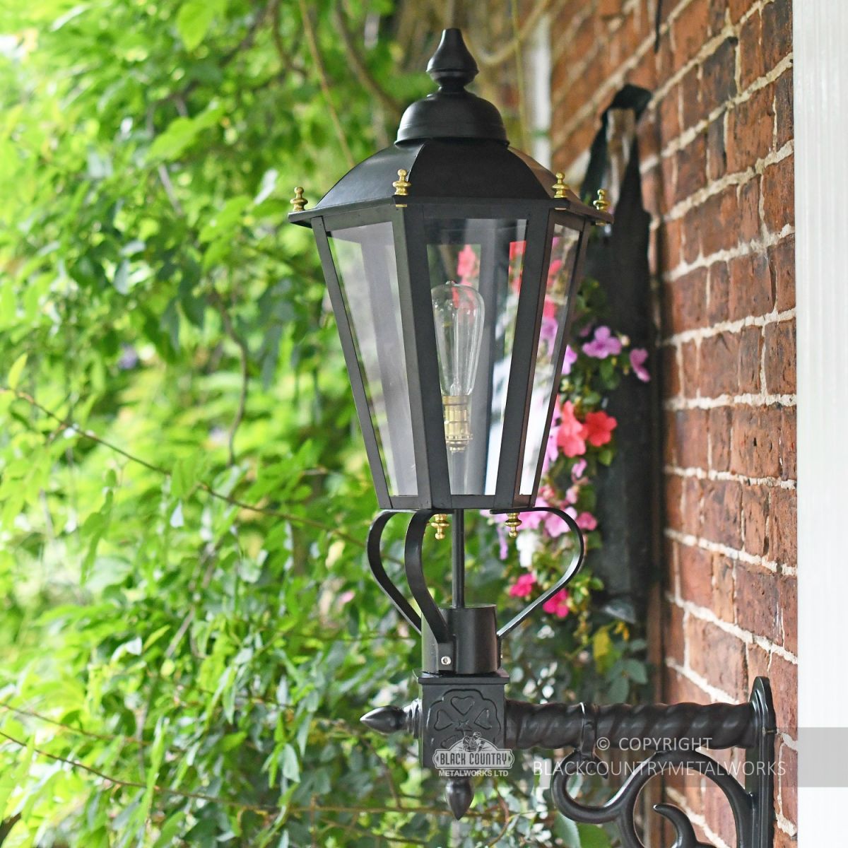 Black Hexagonal Lantern and Cast Scolled Bracket