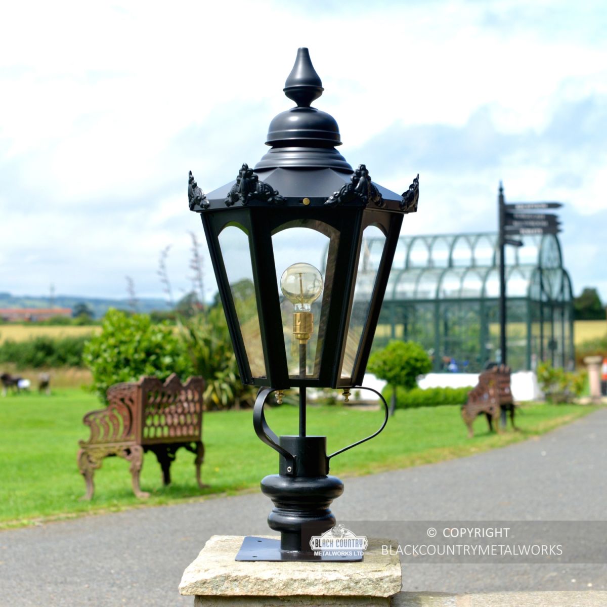 Black Hexagonal Pillar Light and Lantern Set in Situ on a Brick Pillar