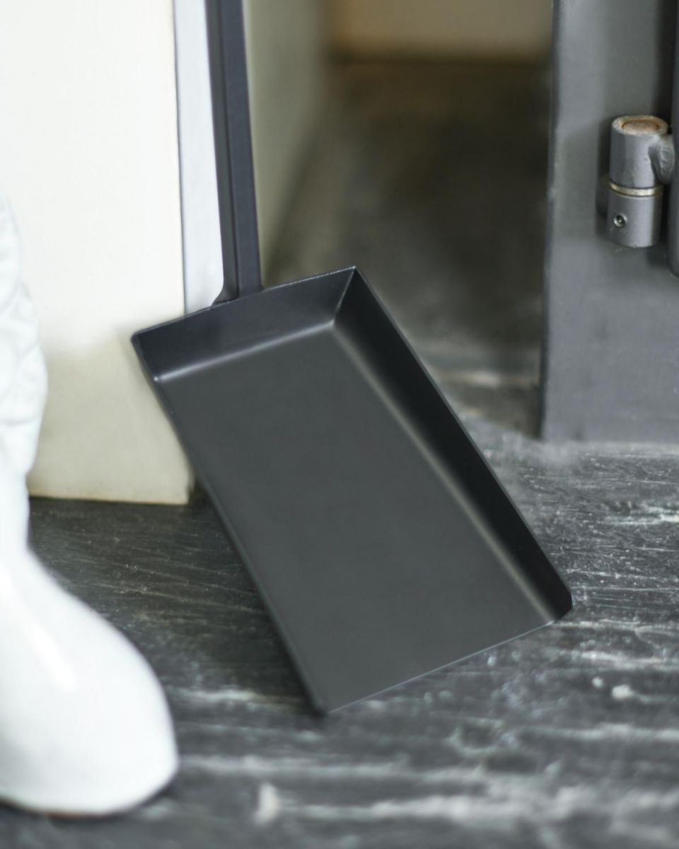 Close Up Of Black Hooked Fireside Shovel Base