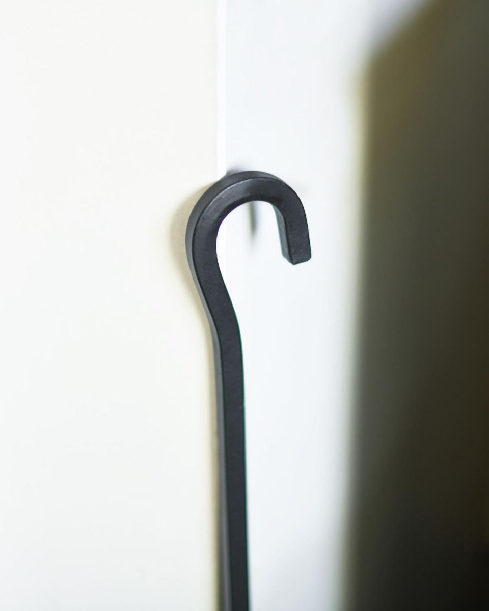 Close Up Of Black Hooked Fireside Shovel Hooked Handle