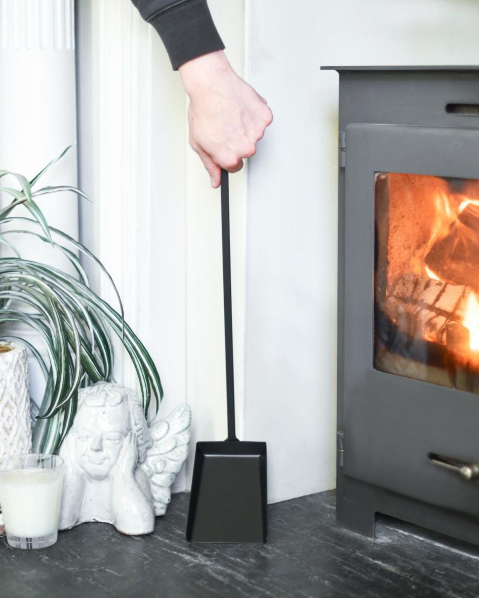 Scale Shot Of Black Hooked Fireside Shovel