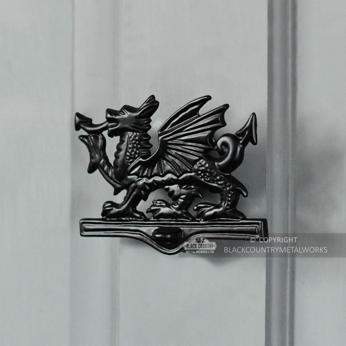 Black Iron Welsh Dragon Door Knocker On Grey Door