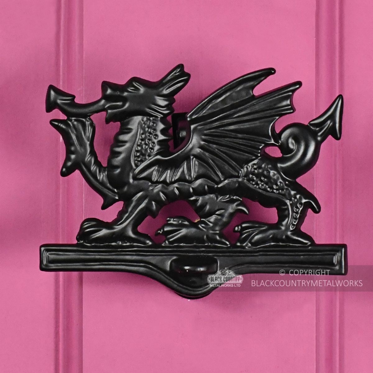 Black Iron Welsh Dragon Door Knocker On Pink Door
