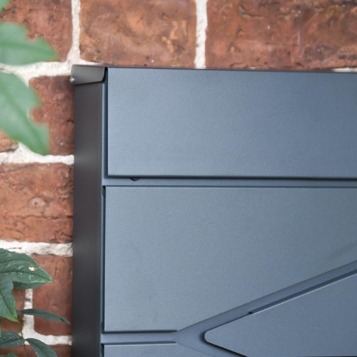 Close-Up of Modern Design on Wall Mounted Post Box