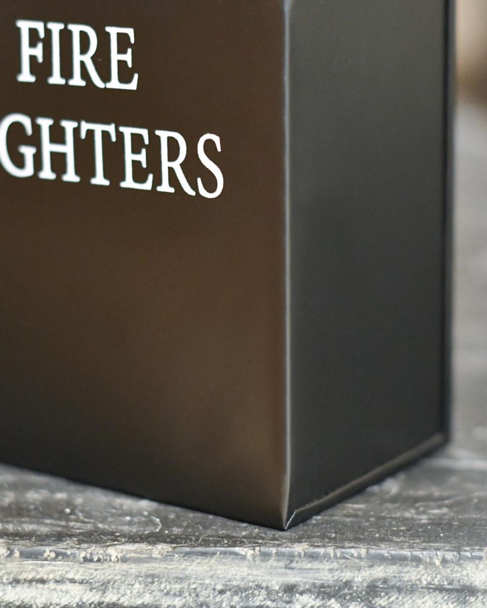 Close Up Of Black Metal "Fire Lighters" Holder Finish Close Up Of Black Metal "Fire Lighters" Holder Finish
