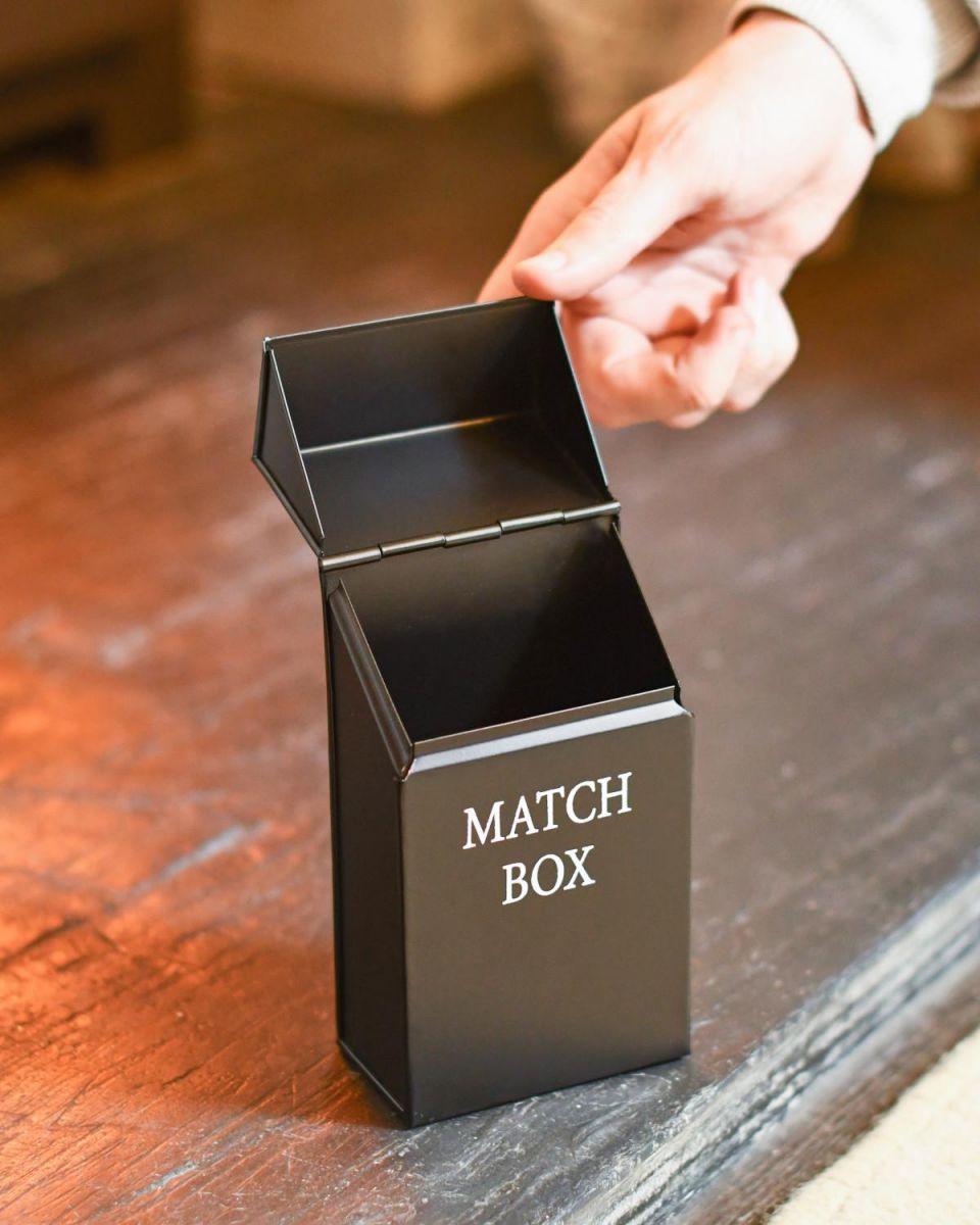 Scale Shot Of Black Metal "Match Box" Holder