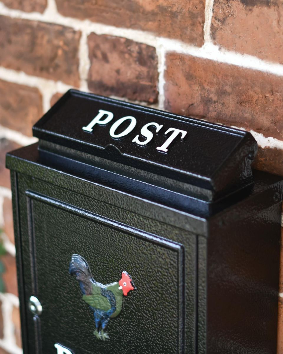 Close-Up of White "POST" Text on Letter Flap