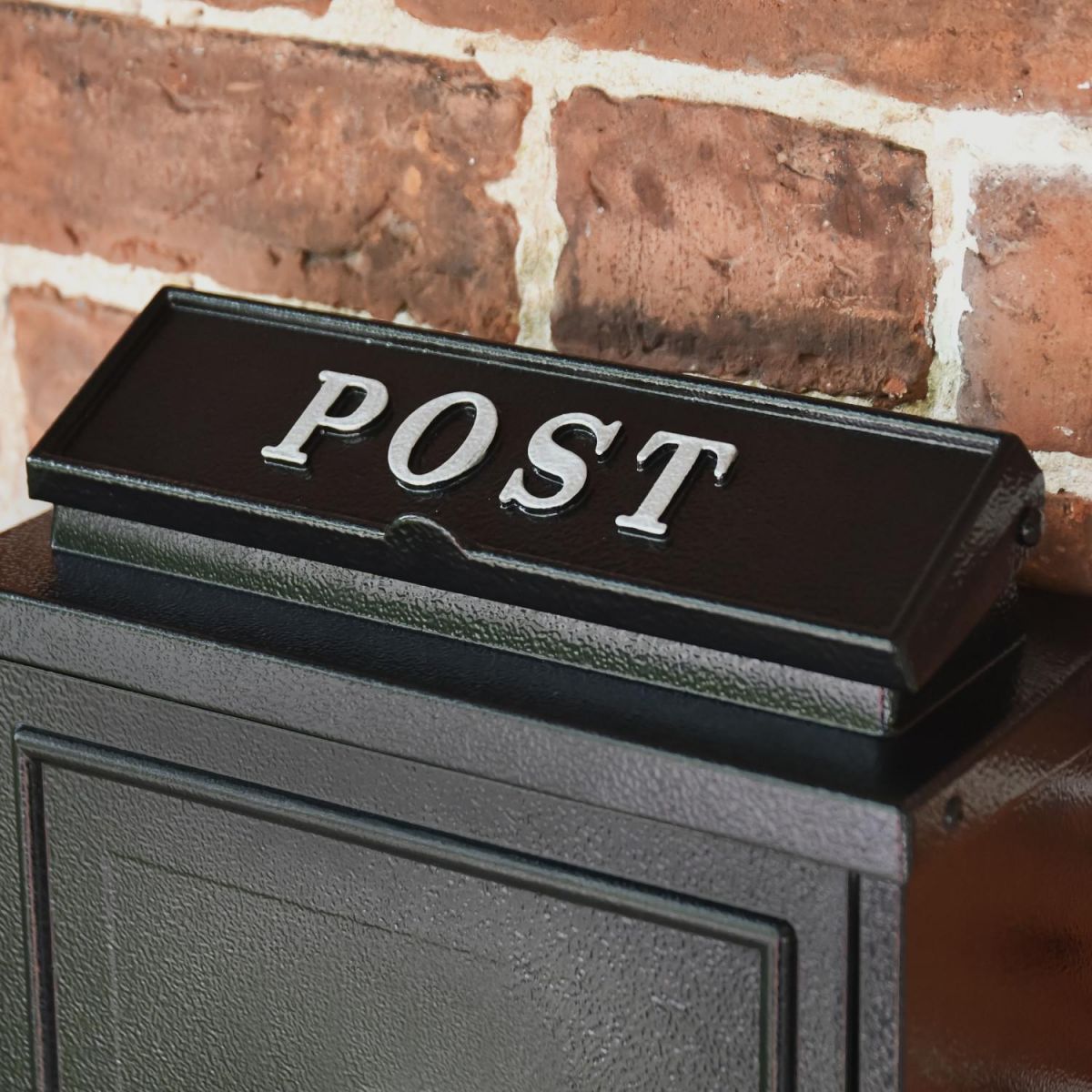 "post" Written on the Letter Flap on the Top of the Post Box