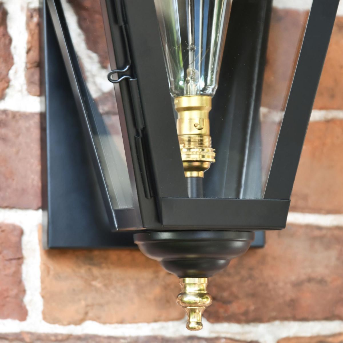 Close-Up of Black & Polished Brass Detail on Wall Lantern
