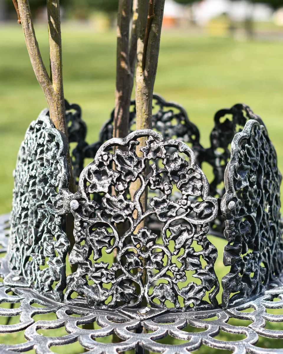 Close-Up of Black & Silver Ornate Tree Seat Close-Up of Black & Silver Ornate Tree Seat