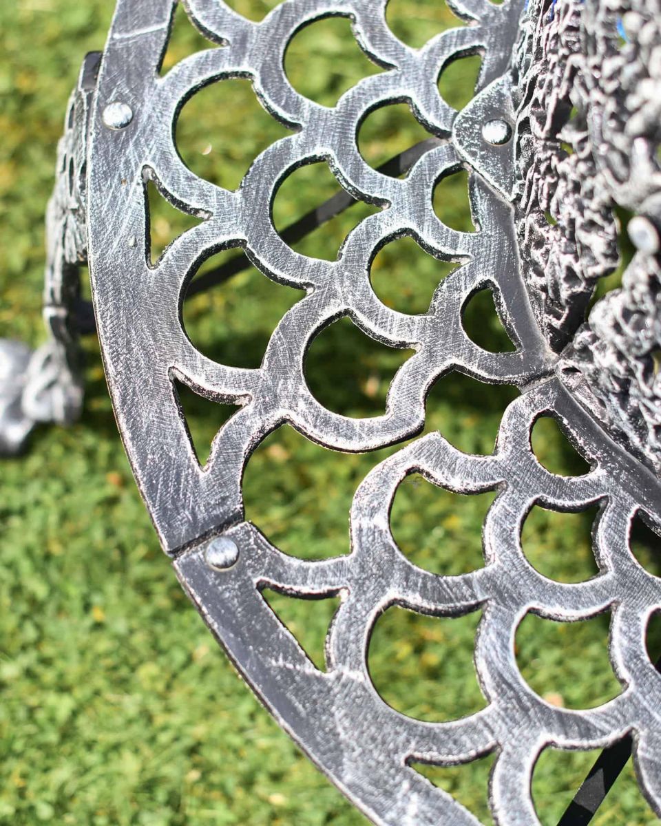 Close-Up of Seat Pattern on Black & Silver Ornate Tree Seat Close-Up of Seat Pattern on Black & Silver Ornate Tree Seat