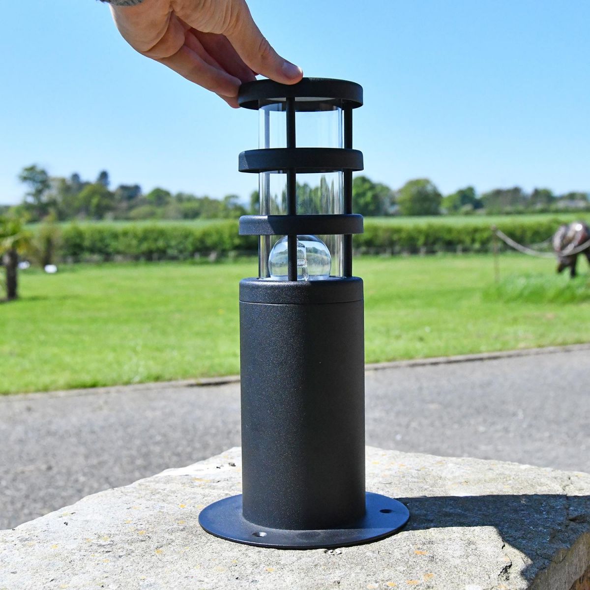 Black Stainless Steel Contemporary Pedestal Light to Scale